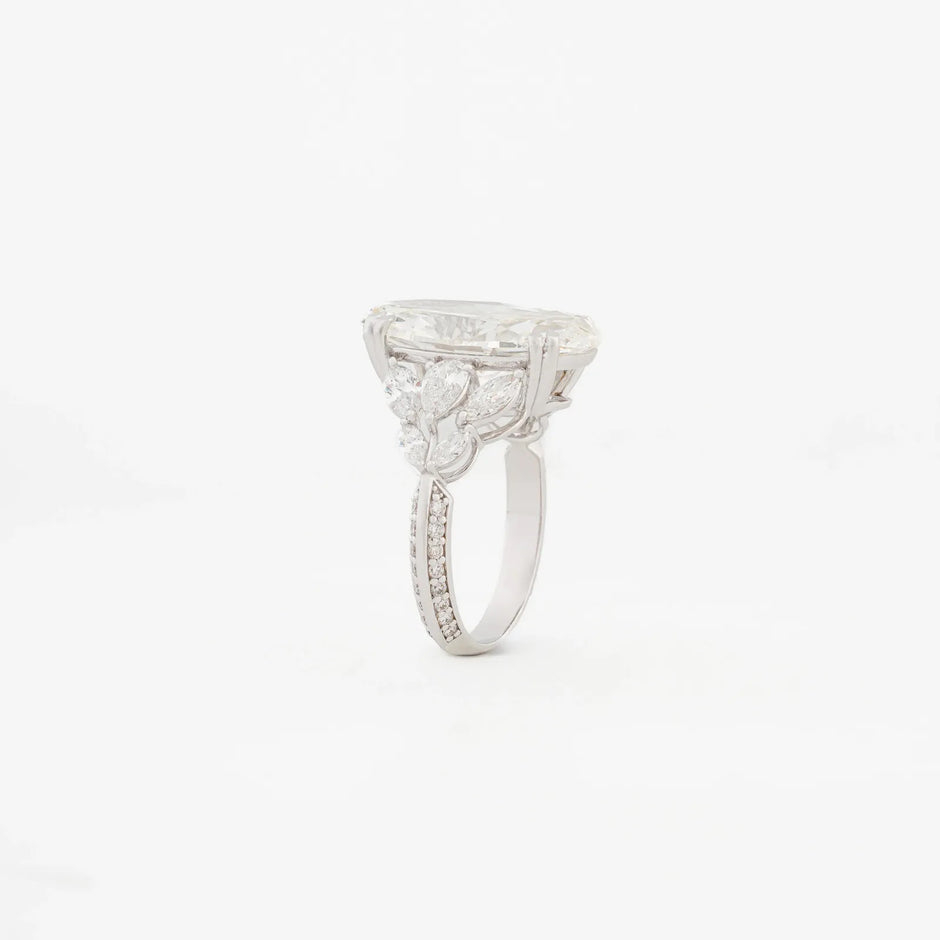 Serenade Pear Three-Stone Pavé Ring — angled view