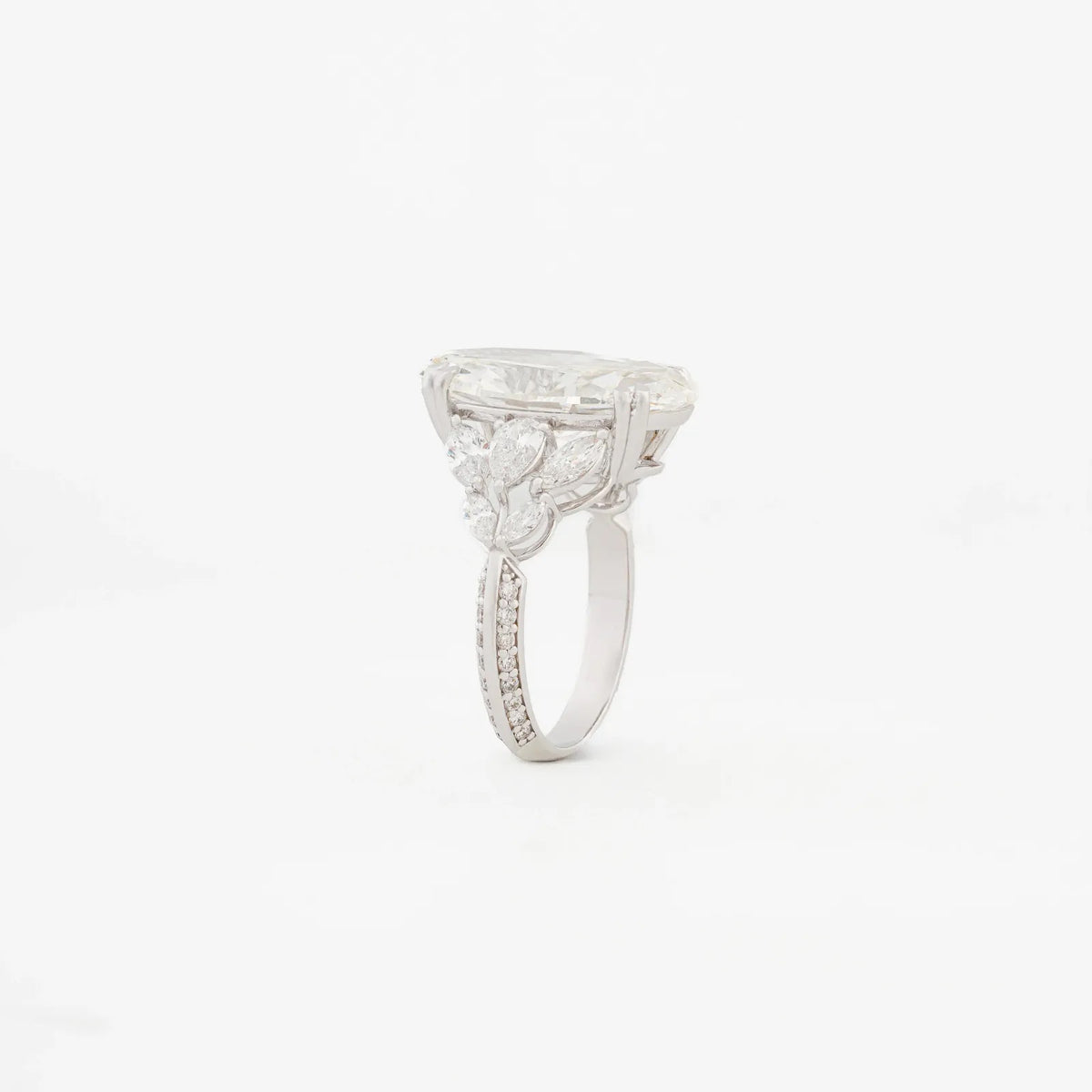 Serenade Pear Three-Stone Pavé Ring — angled view
