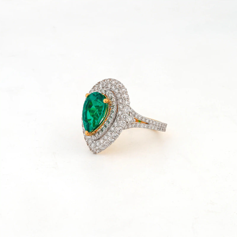 Viridia Pear Emerald Halo Statement Ring — angled view