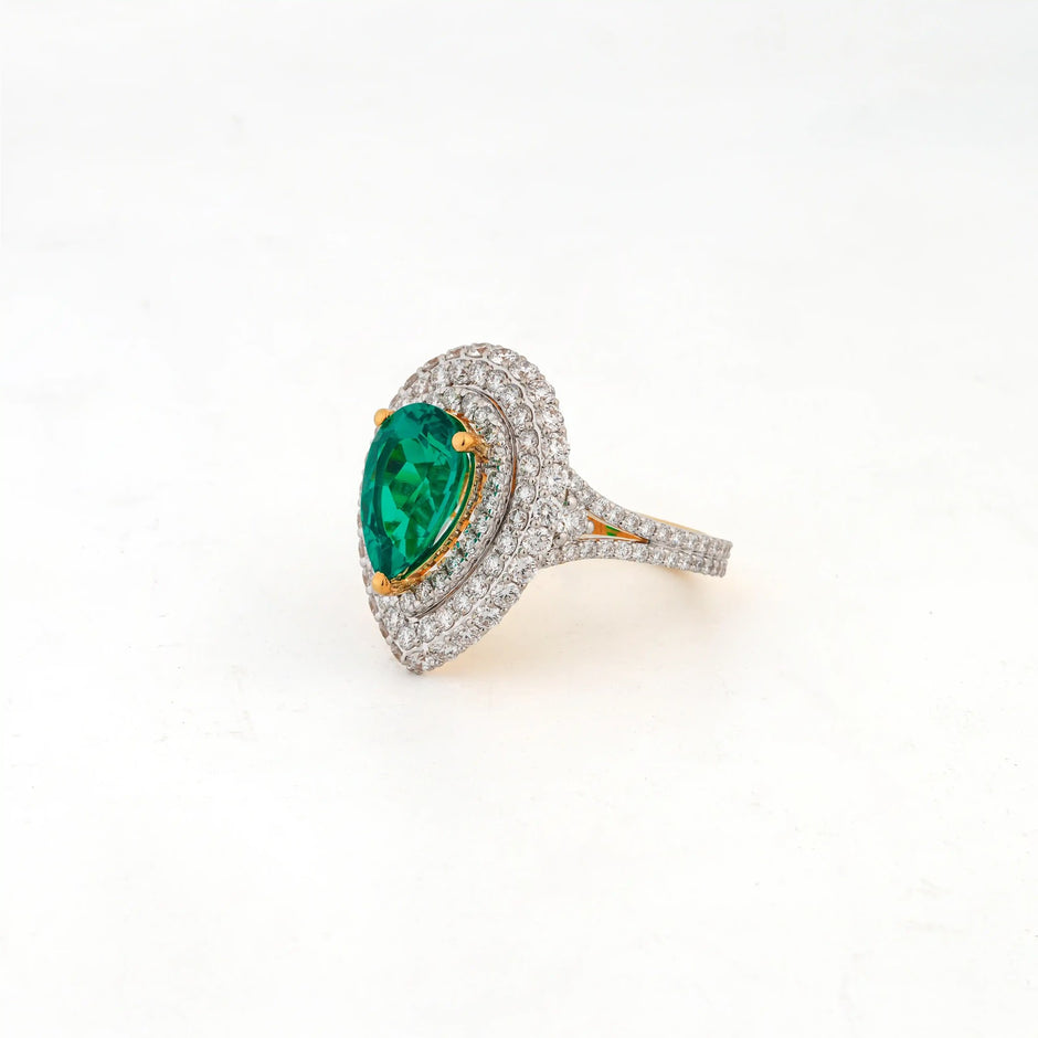 Viridia Pear Emerald Halo Statement Ring — angled view