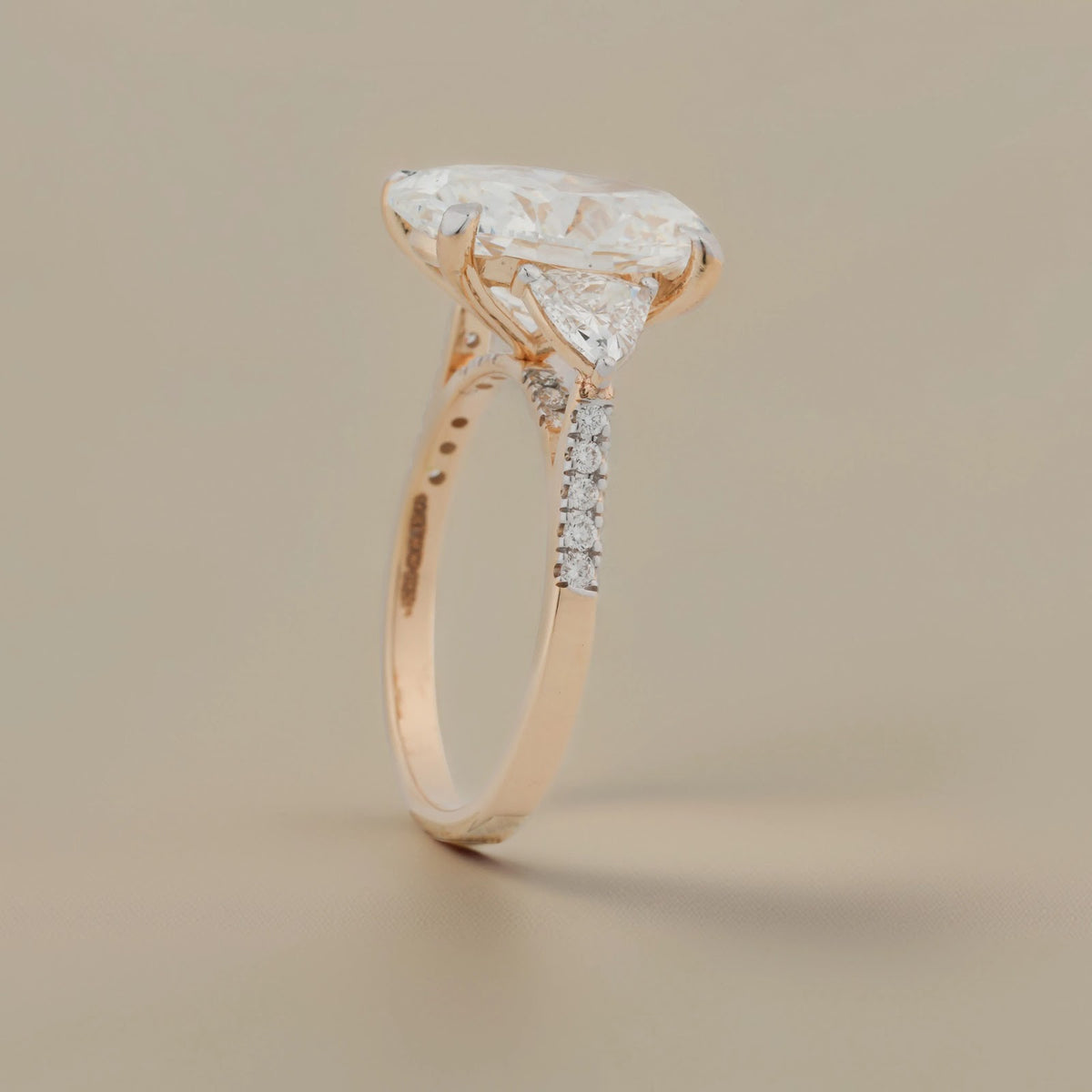Evelisse Oval Pear-Side Three-Stone Ring — angled view