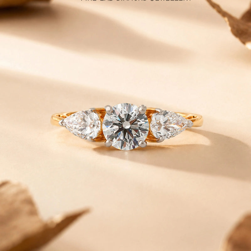 Round and Pear Three-Stone Diamond Ring - front view