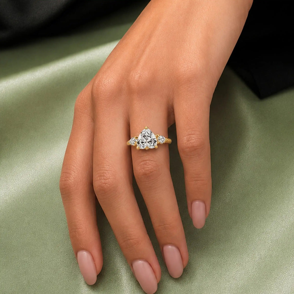 Trillium Pear Three-Stone Diamond Ring — worn view