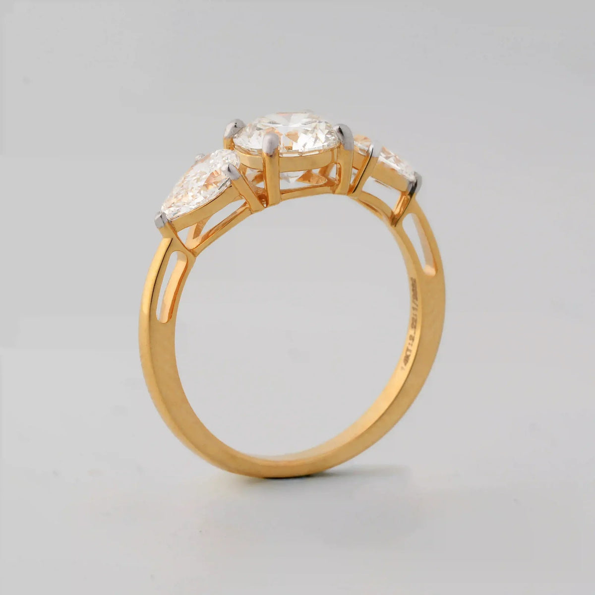 Round and Pear Three-Stone Diamond Ring - side view
