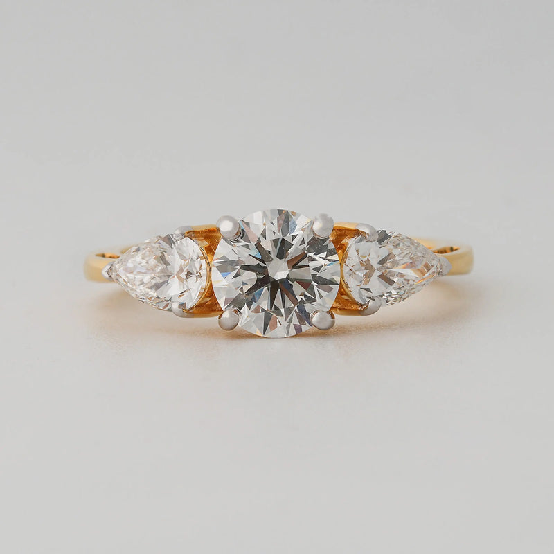 Round and Pear Three-Stone Diamond Ring - angled view