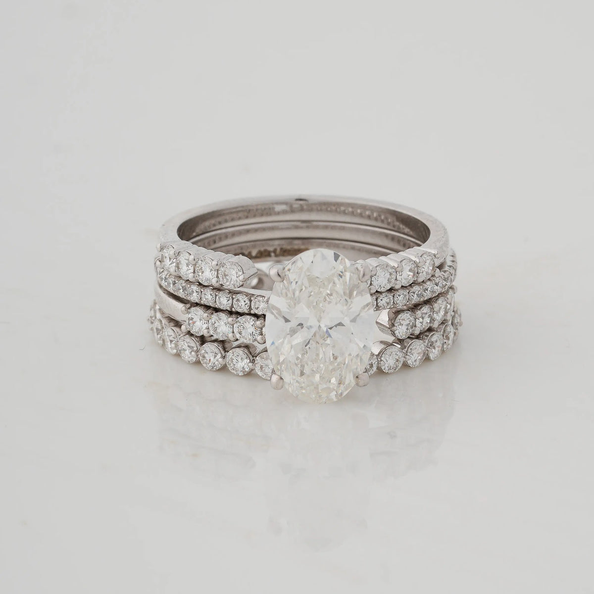 Oval Diamond and Emerald Stacked Ring - angled view