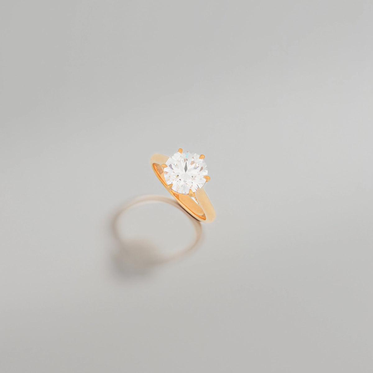Neria Round Raised-Basket Solitaire Ring — angled view