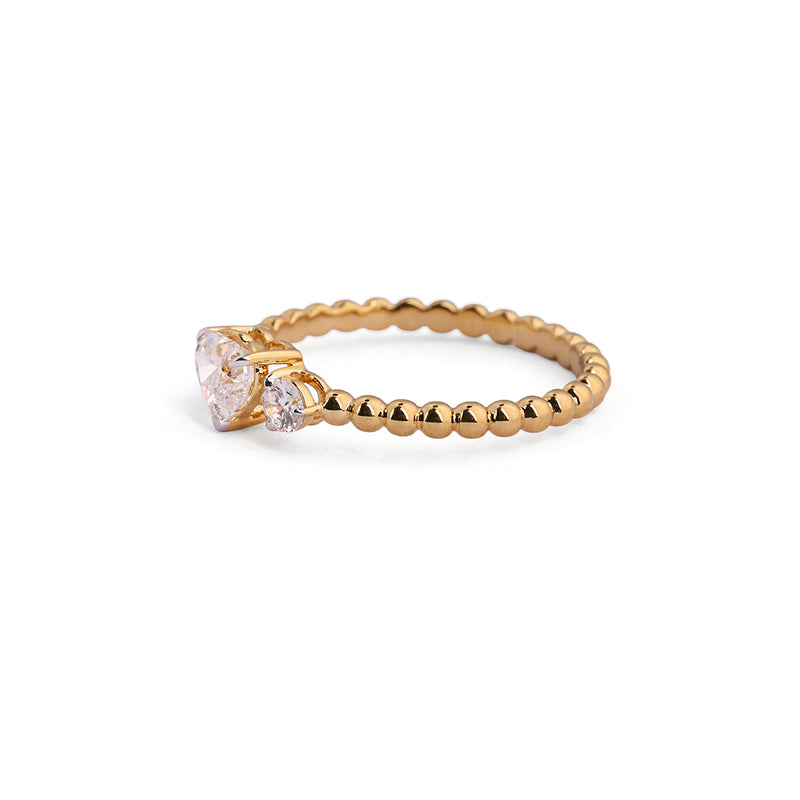 Heart-centre three-stone lab-grown diamond ring with beaded band angled view